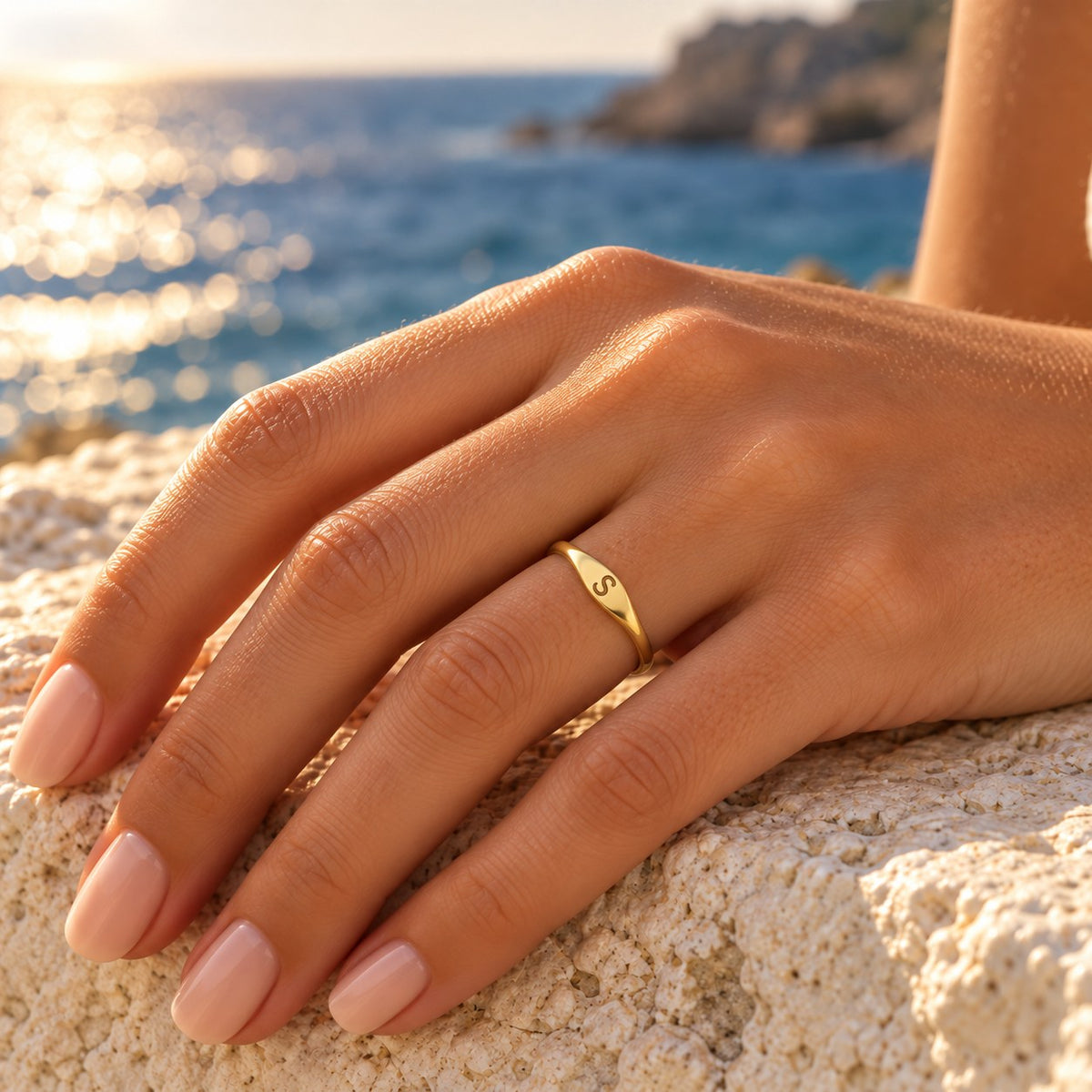 Velmora initial letter ring in the sun by the sea